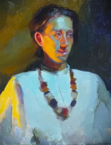 Portrait of a woman in white with a beaded necklace