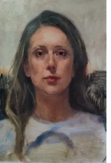 Portrait of a woman with a direct, contemplative gaze